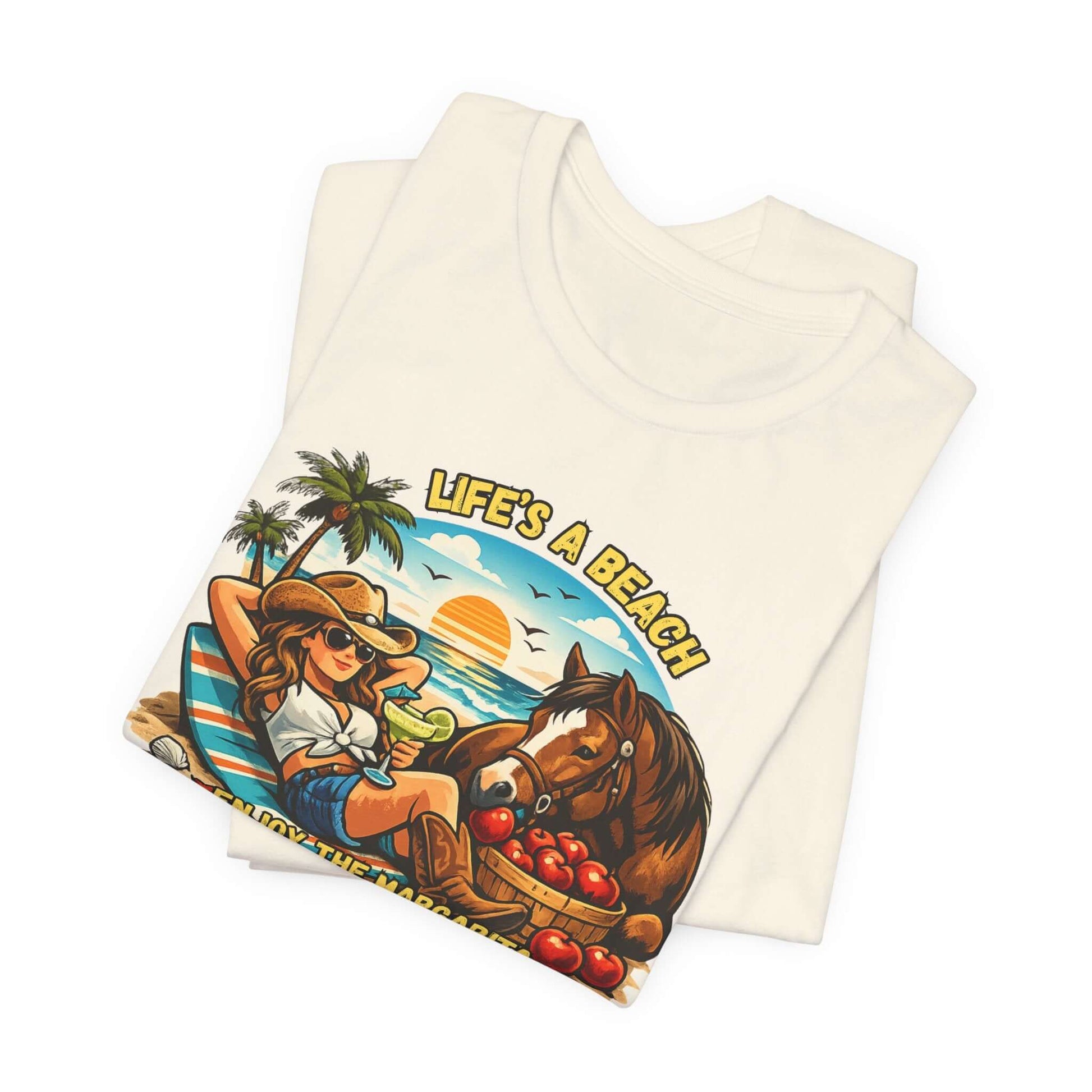 Life's A Beach Western Tee featuring a cowgirl, sunset, and horse, perfect for casual summer wear.