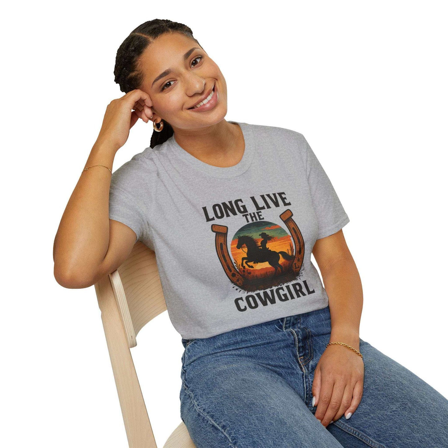Woman wearing Long Live the Cowgirl horseshoe graphic t-shirt, showcasing cowgirl apparel with a relaxed smile.