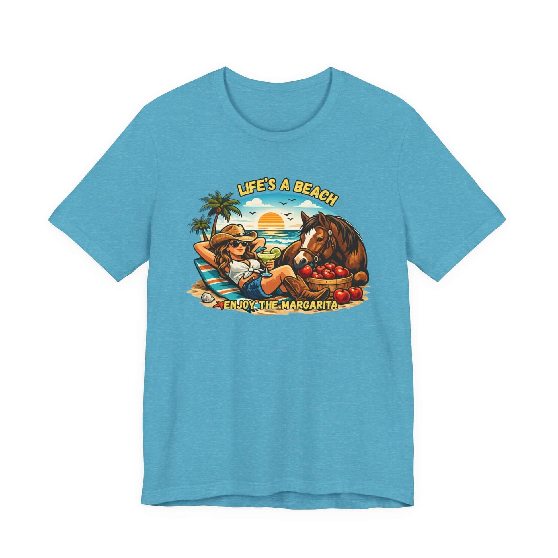 Life's A Beach Western Tee featuring a cowgirl, horse, and tropical scene on a blue shirt.