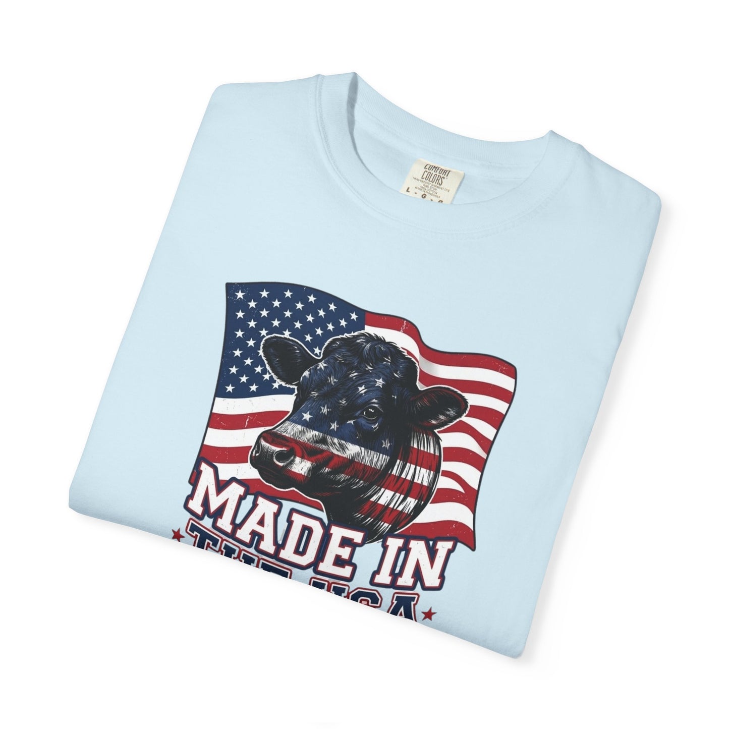Rancher T-Shirt featuring a cow graphic with American flag design, Made in the USA, perfect for patriotic wear.