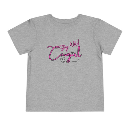 Toddler Cowgirl Tee featuring a playful design with 'Stay Wild Cowgirl' in vibrant colors on a gray background.