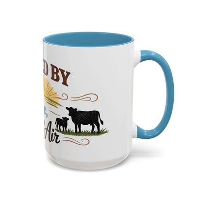 Cow Lovers Mug with blue handle, featuring cows and sun design, perfect for farm lovers.