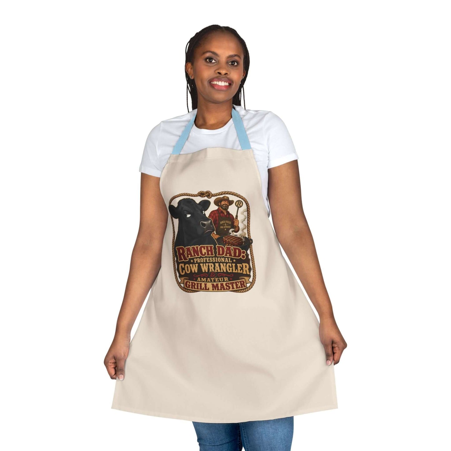 Ranch Dad Apron featuring a humorous cow wrangler graphic, perfect for grill masters and Father's Day gifts.