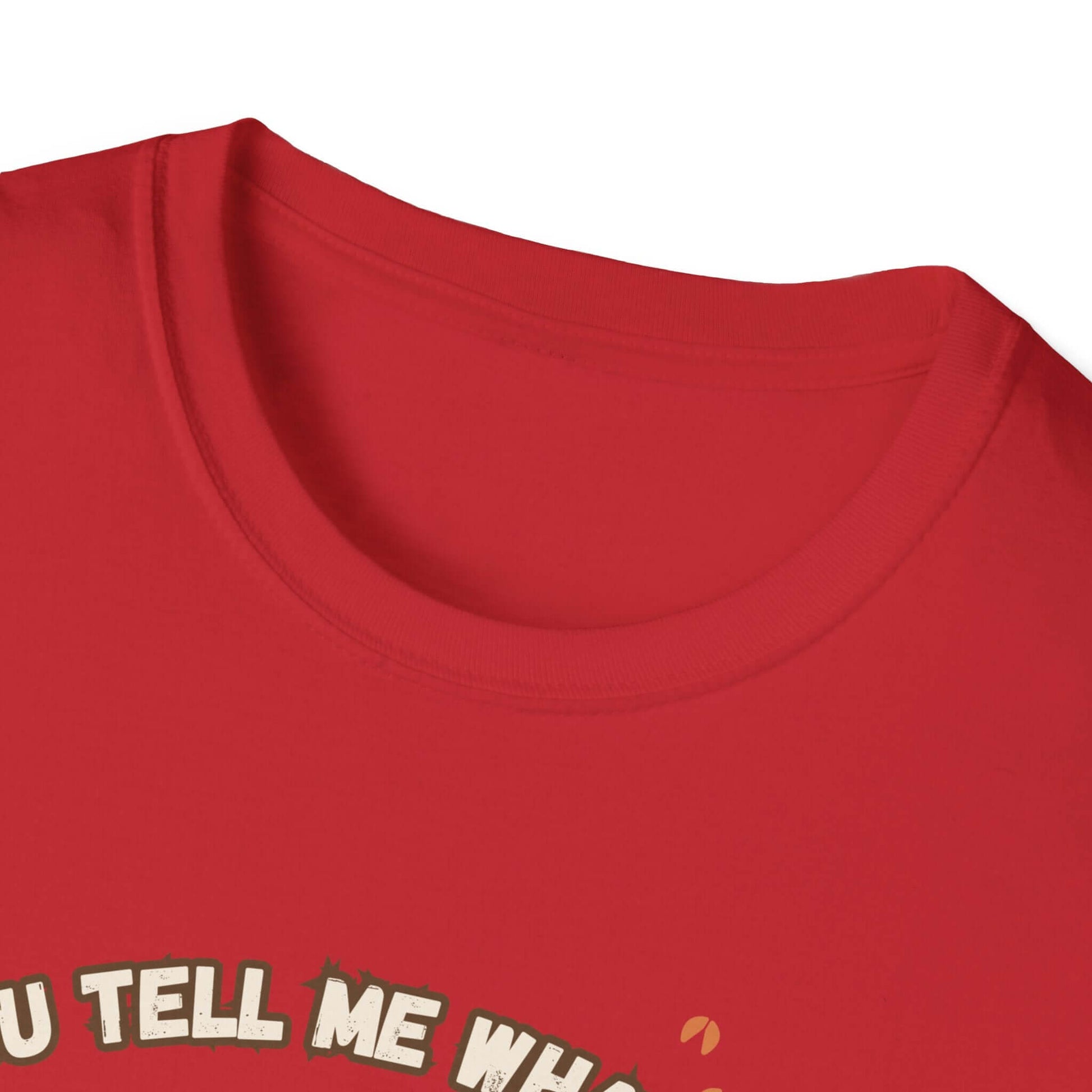 Working Cows Humor T-Shirt close-up on red fabric showcasing the classic crewneck design and witty graphic.