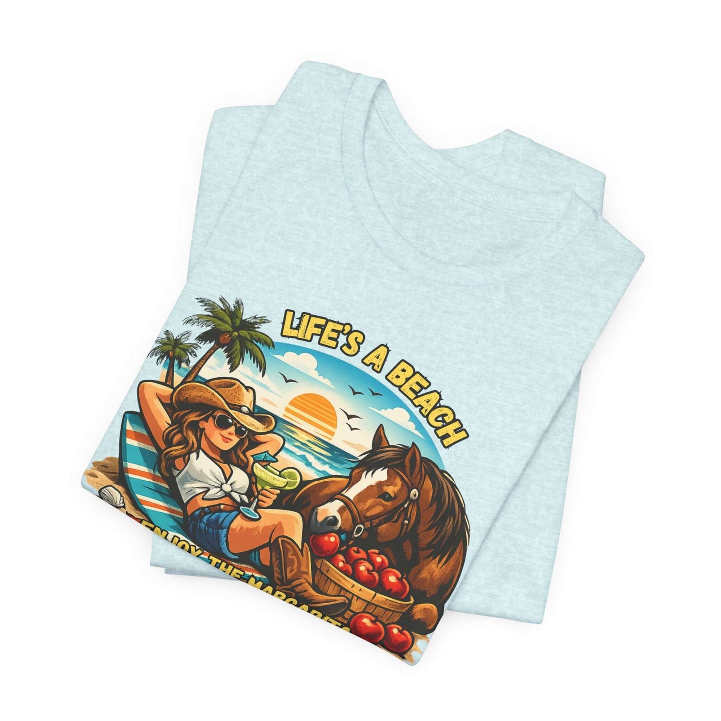 Life's A Beach Western Tee featuring a cowgirl, horse, and sunset design showcasing Western humor.