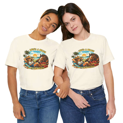 Two women wearing Life's A Beach Western Tee featuring a sunset and cowboy theme, showcasing cowgirl apparel.