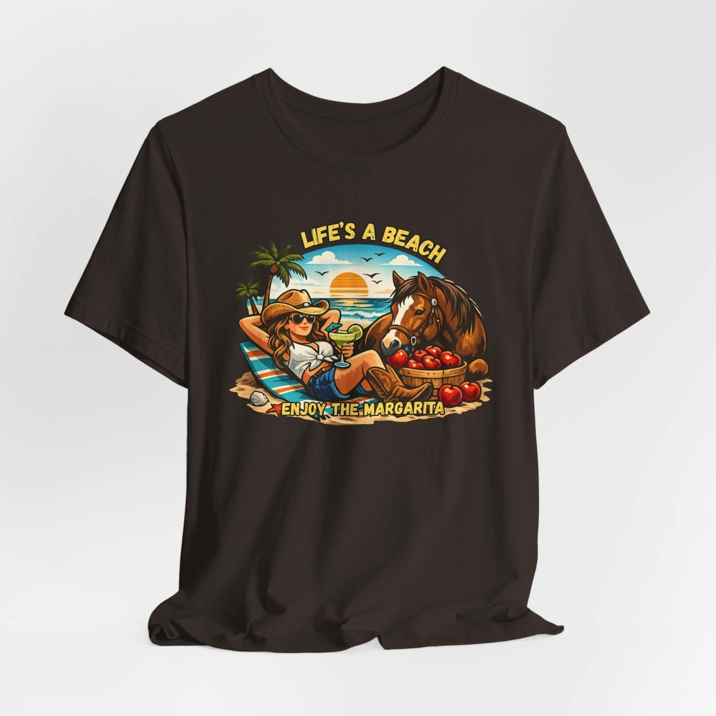 Life's A Beach Western Tee featuring a cowgirl relaxing with a horse and drinks, capturing beach vibes and humor.