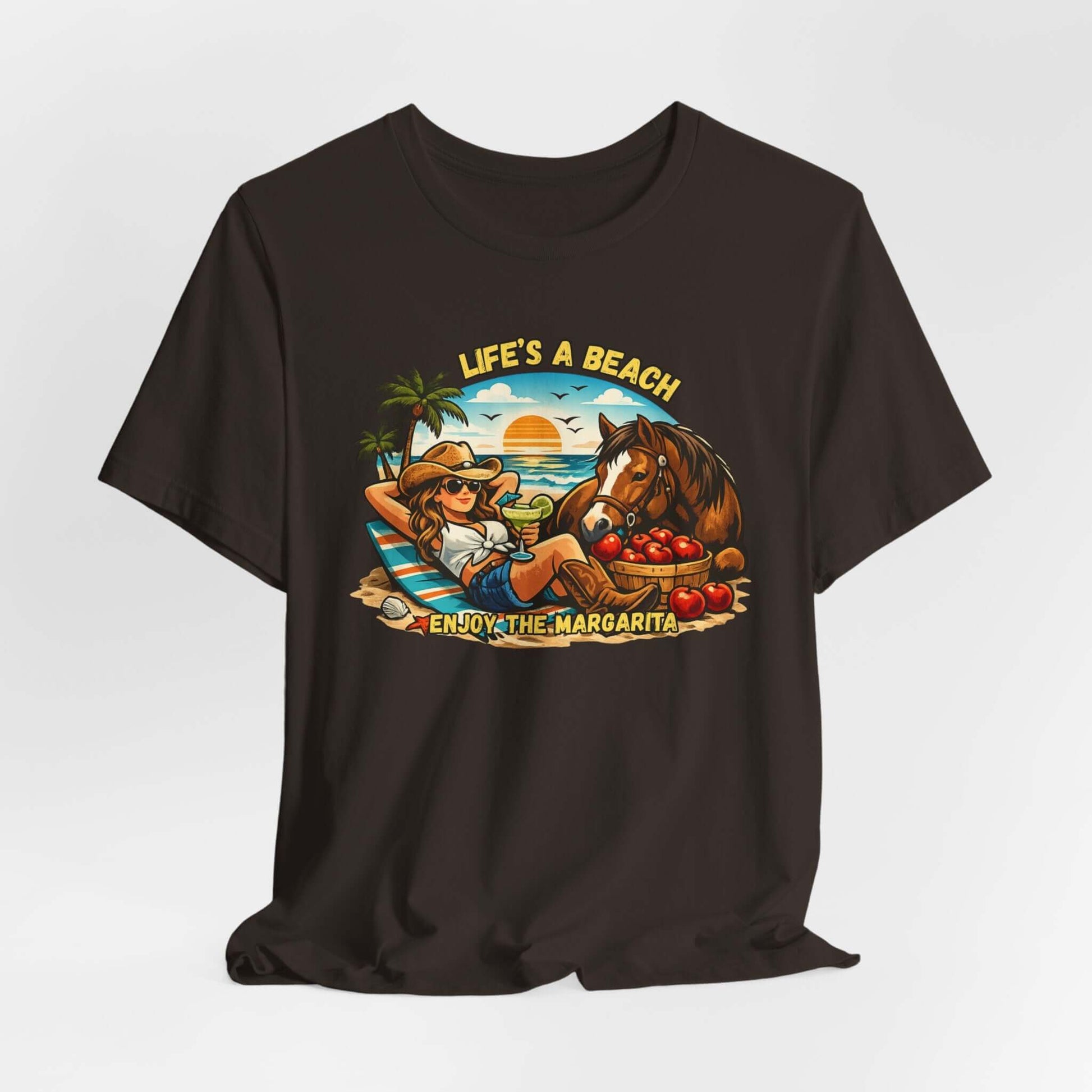 Life's A Beach Western Tee featuring a cowgirl relaxing with a horse and drinks, capturing beach vibes and humor.