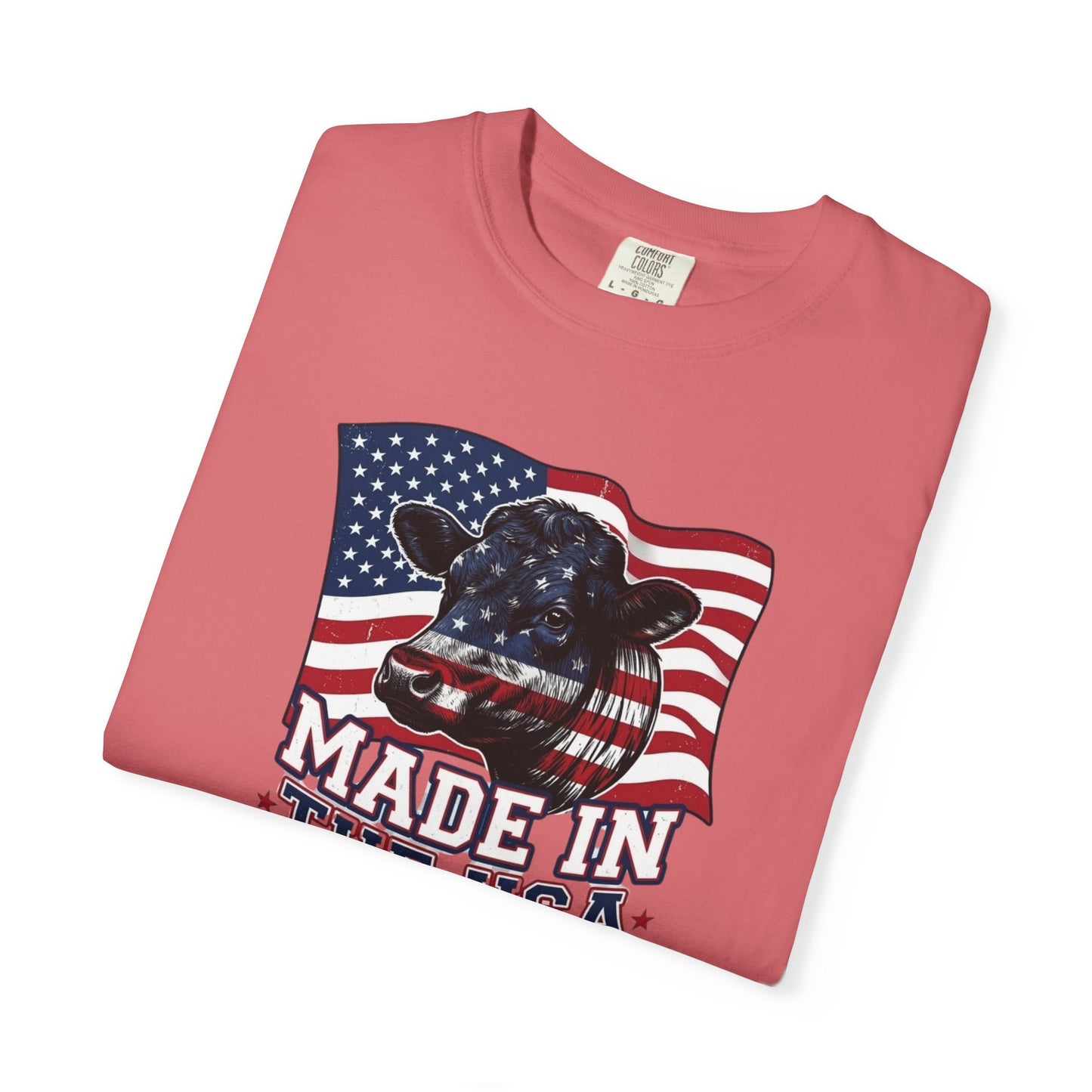 Rancher T-Shirt featuring a cow design with American flag, celebrating patriotism and made in the USA.