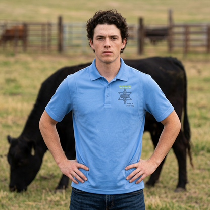 Personalize Sport Polo Shirt worn by a young man, standing confidently in a ranch setting with cows grazing in the background.