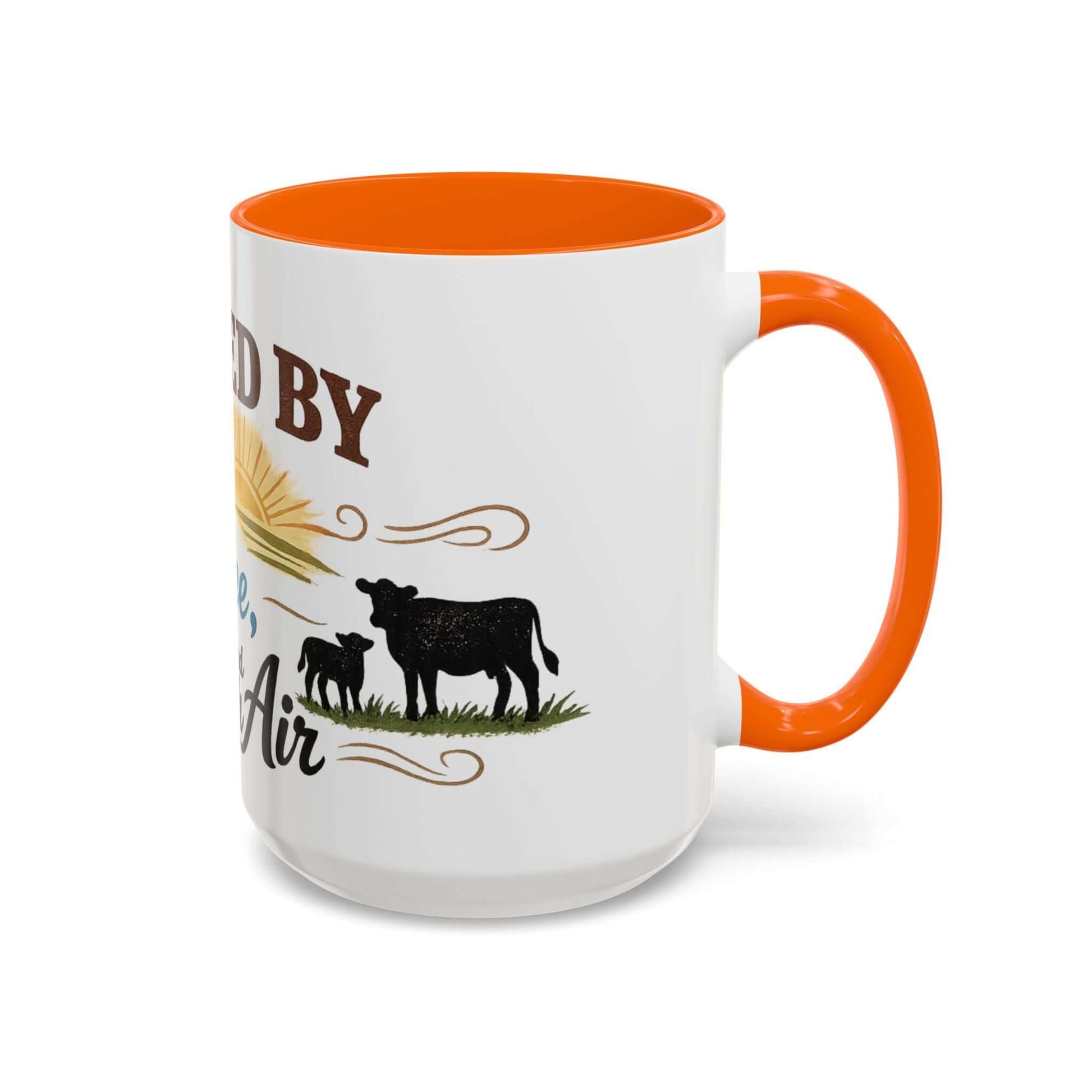 Cow Lovers Mug with graphic design of cows and sunrise, orange handle and interior, perfect for farm lovers.