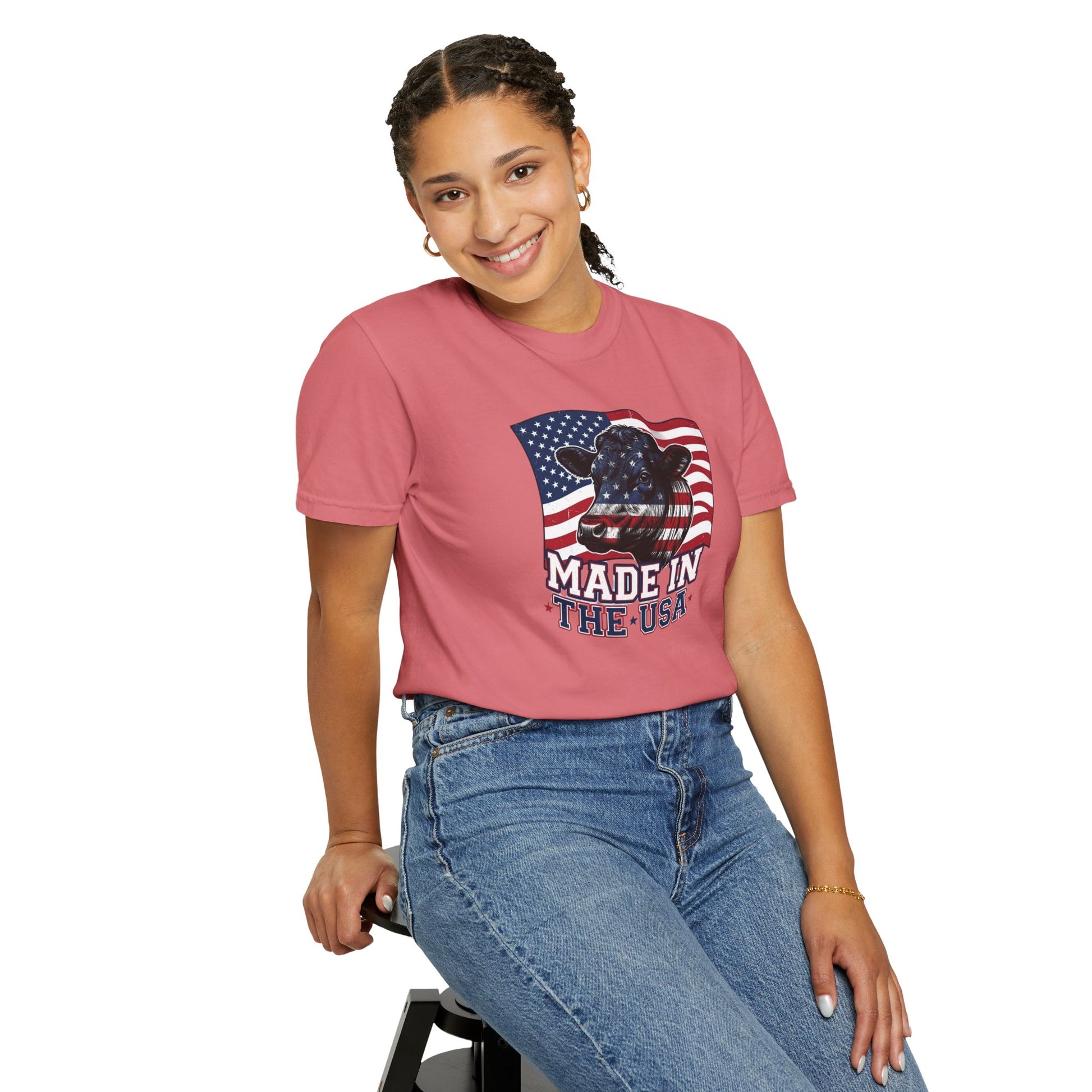 Rancher T-Shirt featuring a patriotic design with American flag and 'Made in the USA' text, worn by a smiling woman.