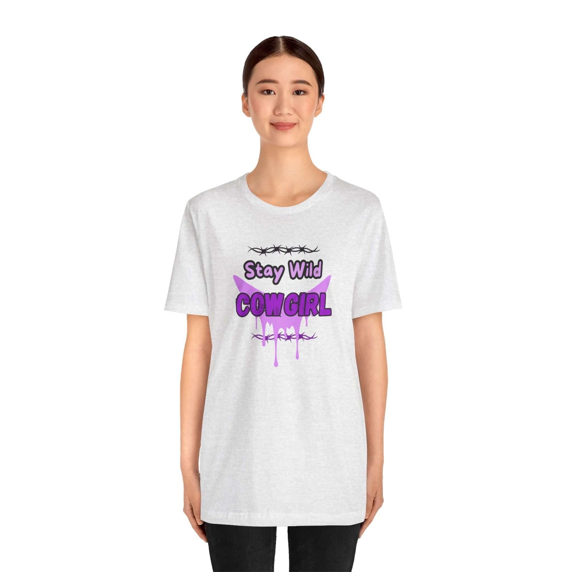Model wearing a Cowgirl Western Tee with "Stay Wild COWGIRL" graphic on a white shirt.