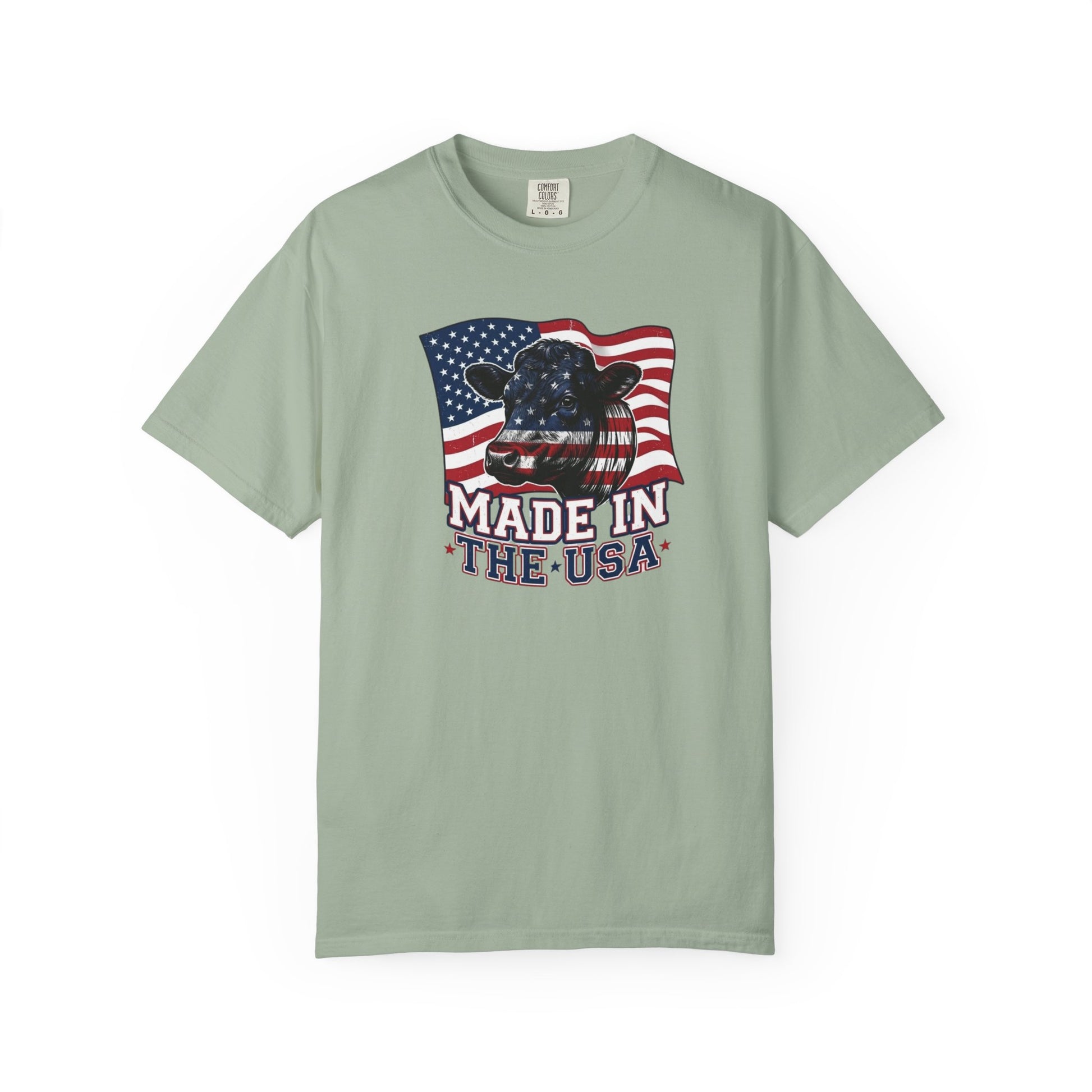 Rancher T-Shirt featuring cow graphic and American flag, made in the USA, patriotic apparel for casual wear.