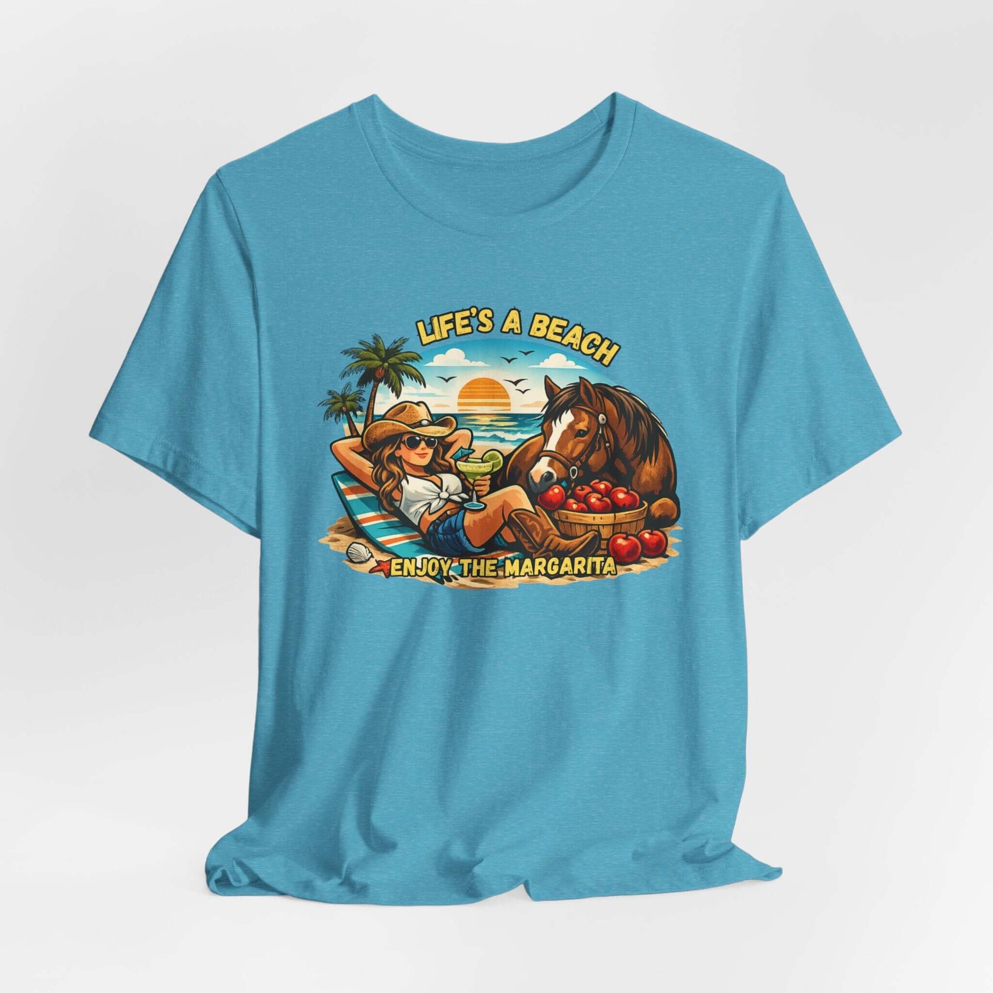 Life's A Beach Western Tee in vibrant blue featuring a cowgirl relaxing with a horse and margarita, perfect for beach lovers.