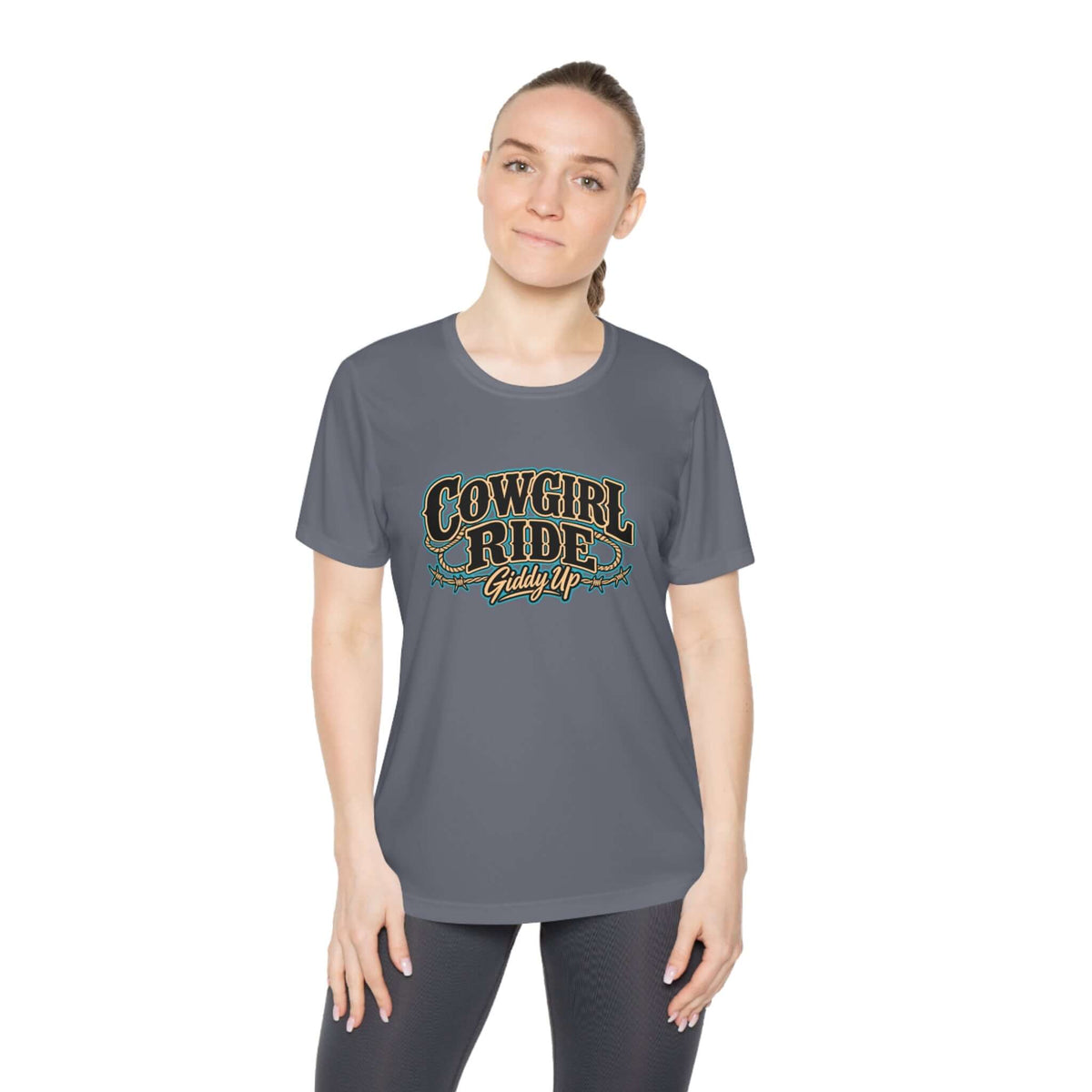 Model wearing Cowgirl Ride Giddy Up Ladies Tee in gray with vintage western graphic.