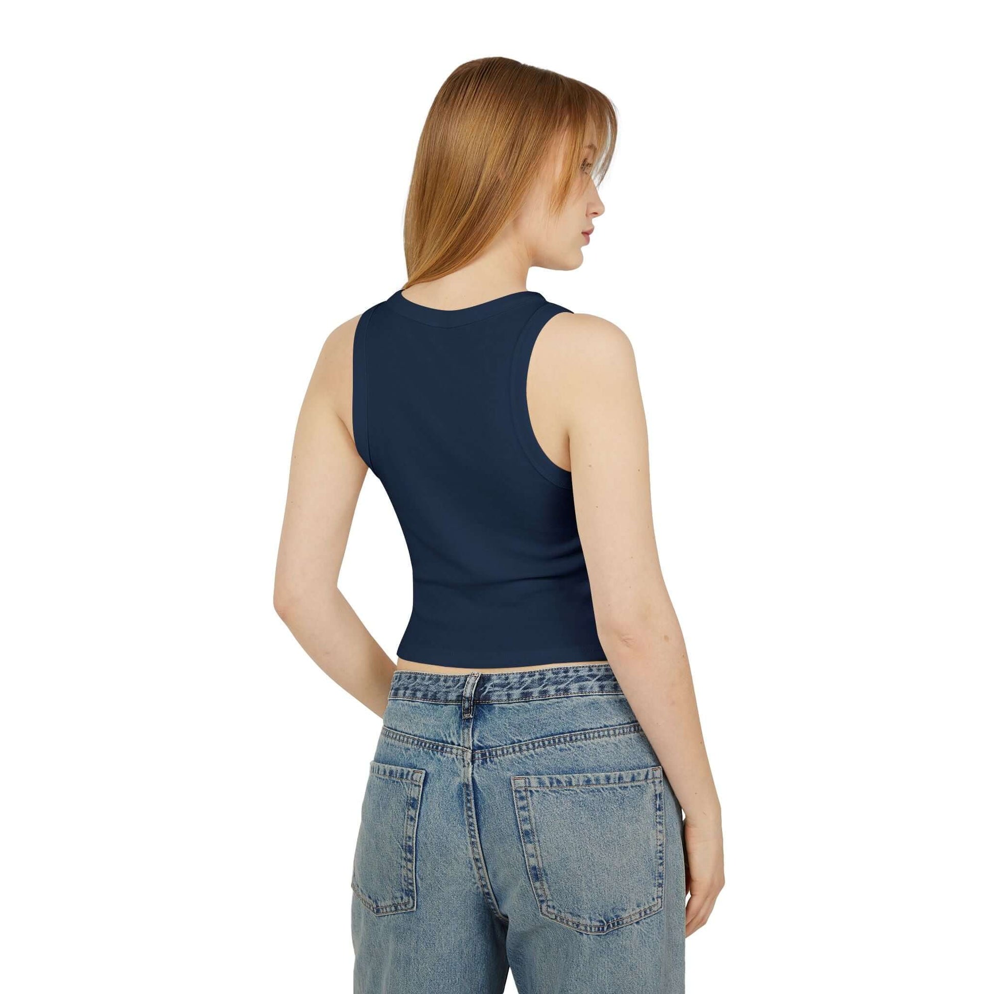 Women Racer Tank in navy, showing the back view, styled with high-waisted jeans for a modern look.