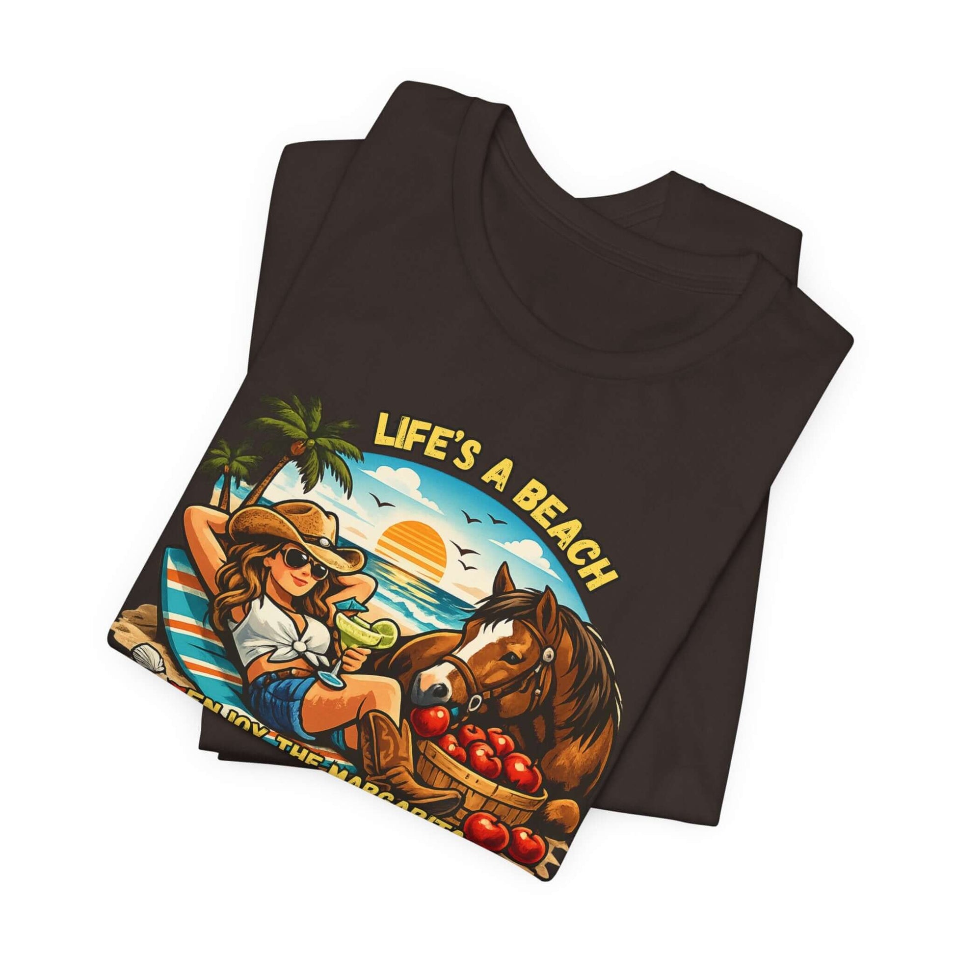 Life's A Beach Western Tee featuring a cowgirl and horse with a beach sunset design on a black t-shirt.