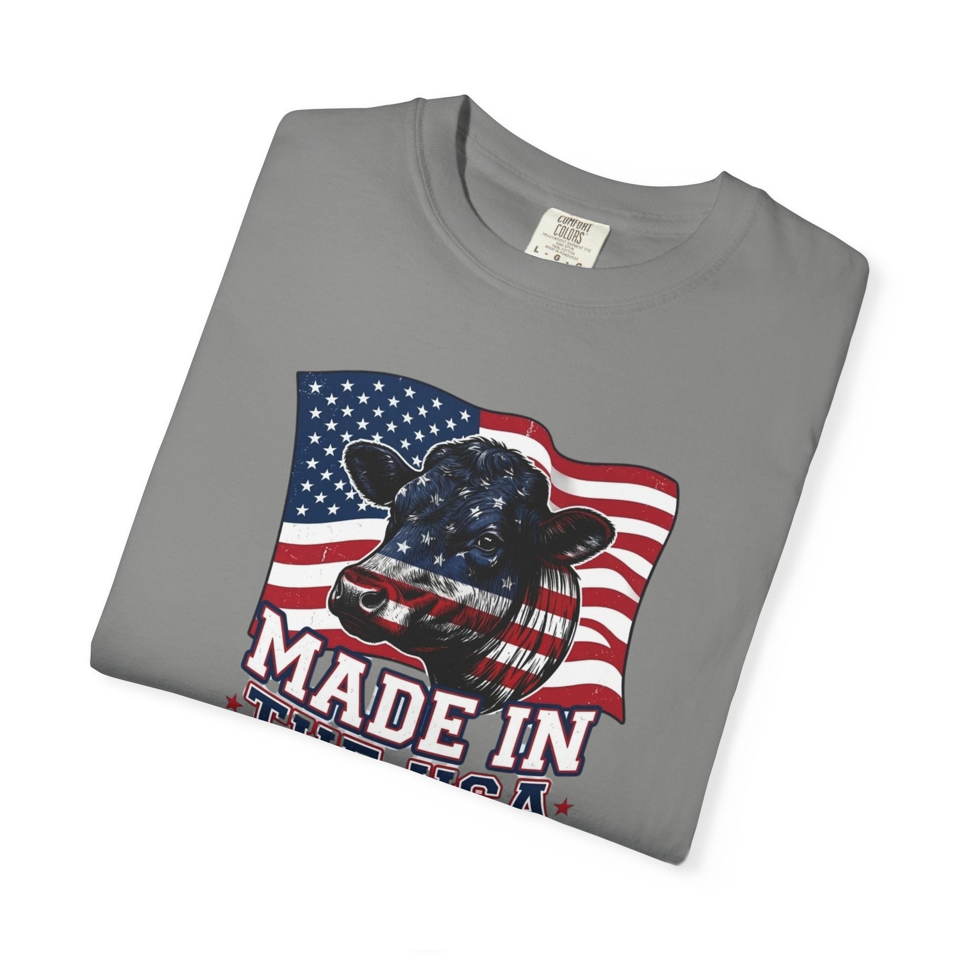 Rancher T-Shirt featuring cow graphic, flag design, and 'Made in the USA' text on a gray fabric.
