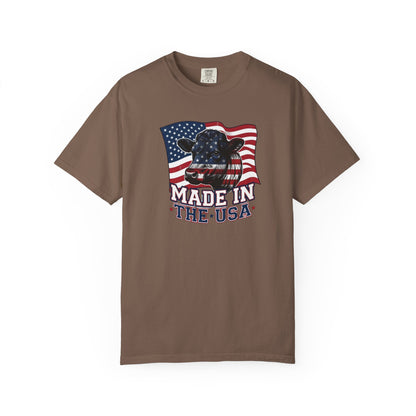 Rancher T-Shirt featuring a cow graphic and American flag design, proudly stating "Made in the USA".