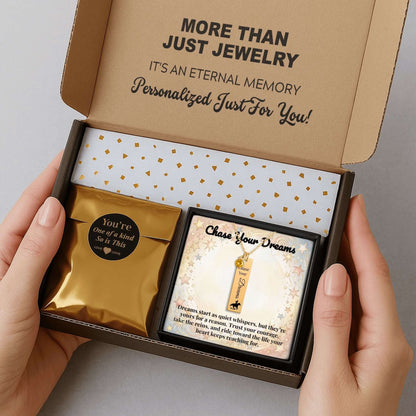 Chase Your Dreams Vertical Bar Necklace presented in a gift box with a meaningful quote and a gold pouch.
