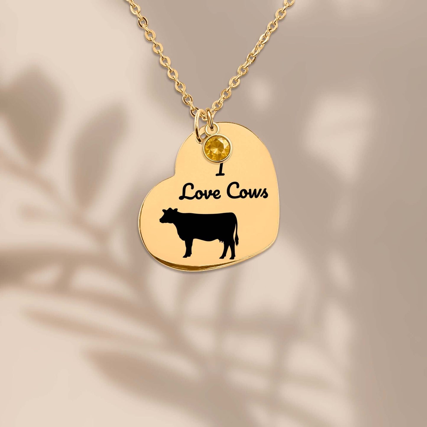 Engraved I Love Cows Heart Necklace featuring a cow design and a gemstone charm.
