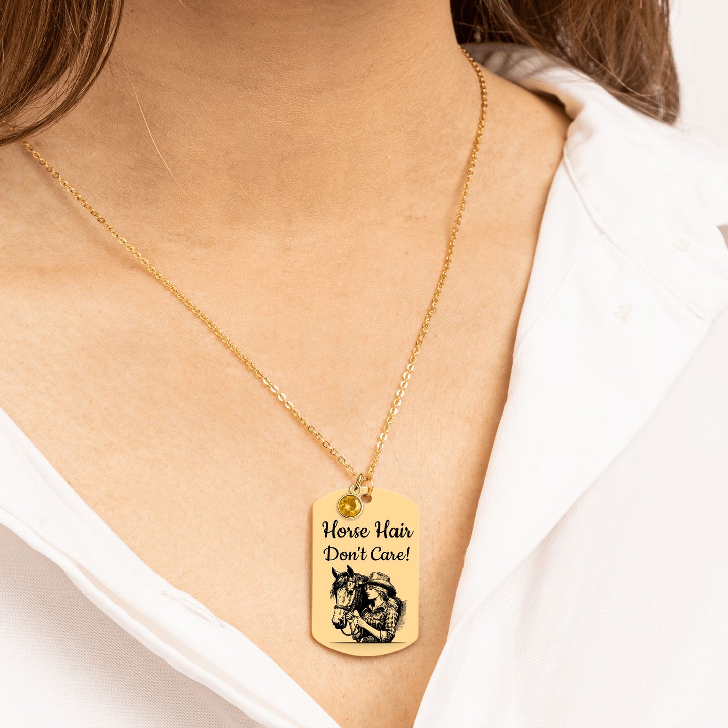 Personalized Cowgirl Tag Necklace featuring a horse design and engraved text 'Horse Hair Don't Care!' in gold.