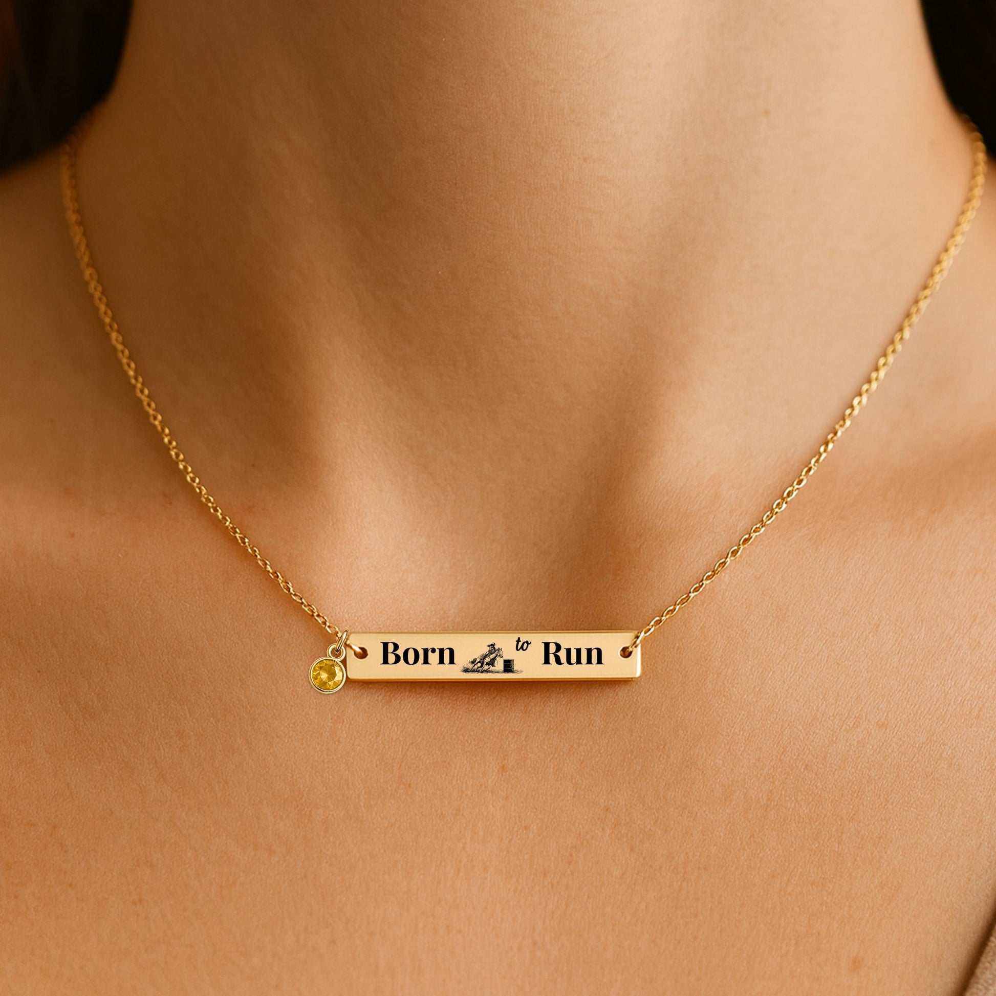 Barrel Racer Horizontal Bar Necklace with engraving 'Born to Run' in gold, featuring a birthstone charm.