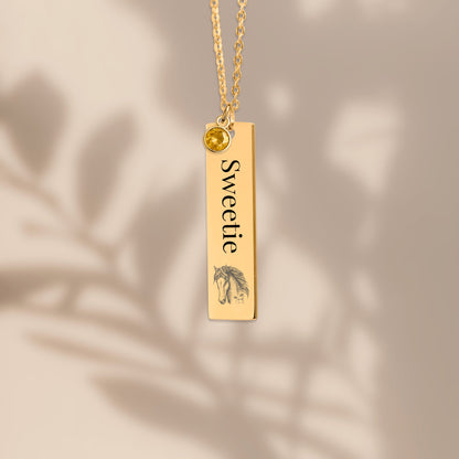 Personalize Vertical Bar Necklace engraved with the word 'Sweetie' and a birthstone charm, elegantly displayed.